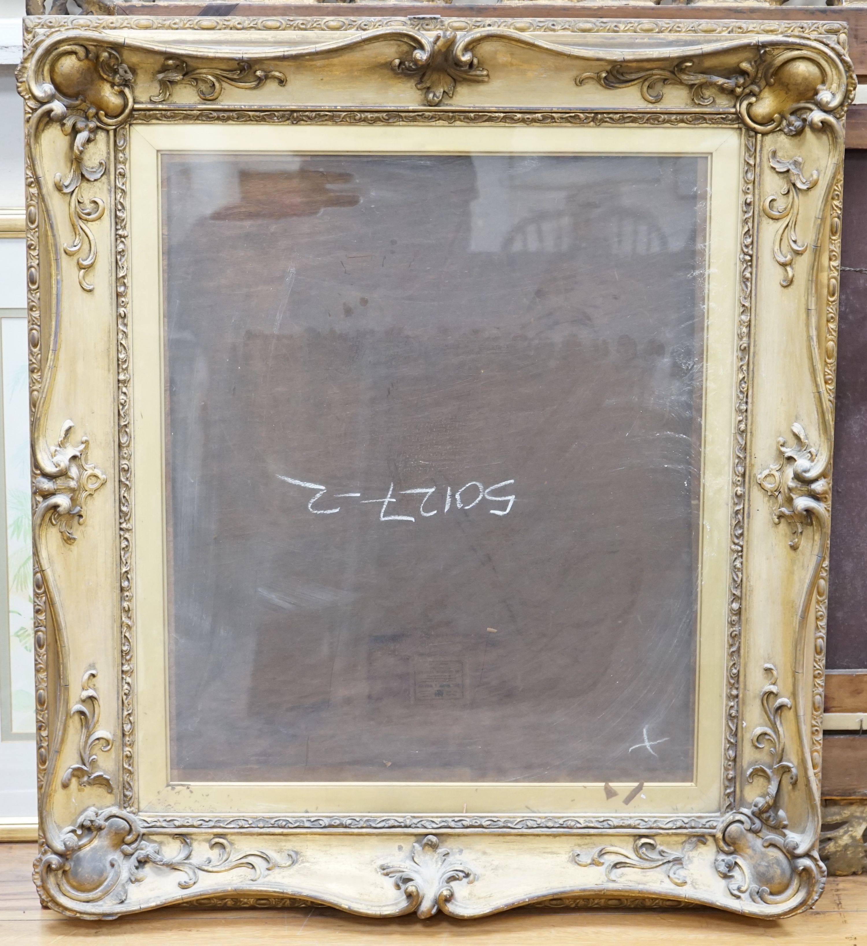 A Victorian giltwood and gesso scroll border picture frame, aperture 58 x 68cm